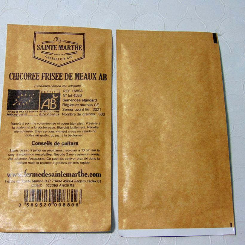 Exemplo de amostra de Chicorée frisée Fine de Meaux Bio - Ferme de Sainte Marthe die Tüte mit 2300 Samen (4g) tal como entregue